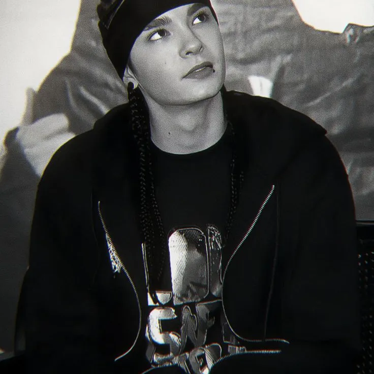 Tom Kaulitz's AI avatar with dynamic vector art style, embodying friendly AI chat capabilities