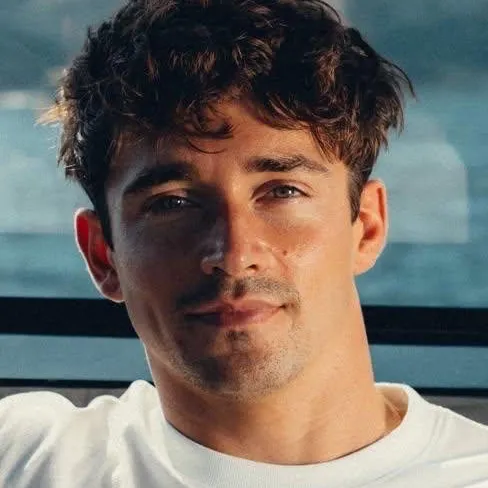 Minimalist Charles Leclerc avatar for google chat integration, featuring adaptive emotional expressions