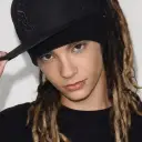 Minimalist Tom Kaulitz avatar for google chat integration, featuring adaptive emotional expressions