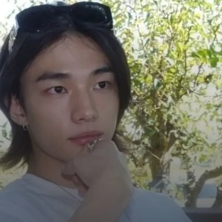 Portrait of a friendly AI chatbot assistant Hyunjin with expressive eyes showcasing personality traits