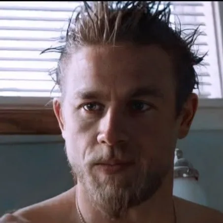 Jax Teller: Futuristic AI chatbot interface with voice chat and neural network-driven traits