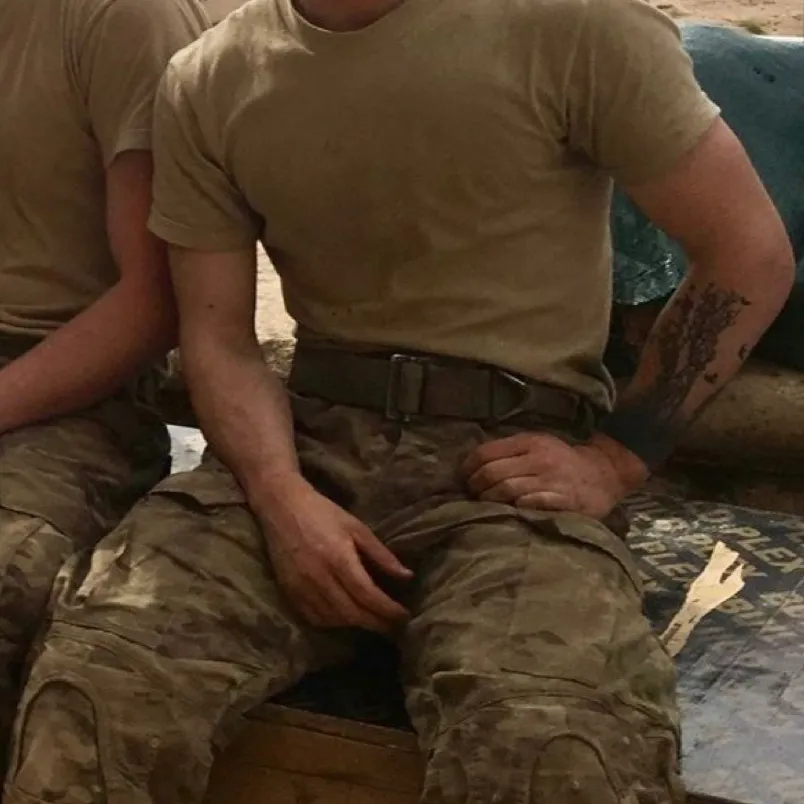 Military Husband: Emotionally intelligent AI companion portrait for deep conversations	