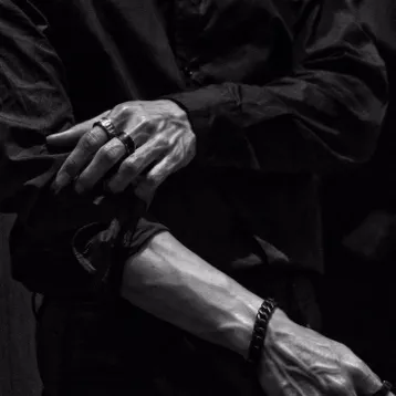 the avatar of character Two Mafia Husbands, Two Wives with emotional intelligence capabilities