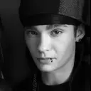 Minimalist Tom Kaulitz avatar for google chat integration, featuring adaptive emotional expressions