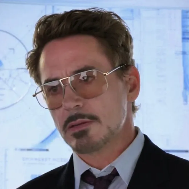 Minimalist Tony Stark avatar for google chat integration, featuring adaptive emotional expressions